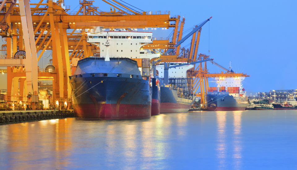 panorama scene of ship yard with heavy crane in beautiful twilight use for import export industry and international world trading